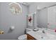 Neat half bathroom with a decorative mirror and soft, light-colored walls at 7212 Morsey Ct, Charlotte, NC 28269
