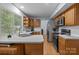 Well-lit kitchen features stainless steel appliances, wooden cabinets, and ample counter space near a bright window at 7212 Morsey Ct, Charlotte, NC 28269
