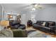 The living room features comfortable seating, an area rug, and views into the adjacent kitchen at 7212 Morsey Ct, Charlotte, NC 28269