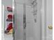 Modern tiled shower with glass door and multi-level shelving at 7212 Morsey Ct, Charlotte, NC 28269