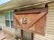 Back Porch, featuring wooden decoration with a horseshoe and star accent, adds charm to outdoor space at 7267 Sandown Ct, Harrisburg, NC 28075