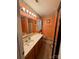 Well-lit bathroom features a vanity with ample counter space and storage and separate tub at 7267 Sandown Ct, Harrisburg, NC 28075