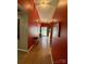 Hallway featuring tile floor and access to the front door at 7267 Sandown Ct, Harrisburg, NC 28075