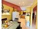 Open kitchen with tile floors, wooden cabinets, and white appliances at 7267 Sandown Ct, Harrisburg, NC 28075