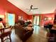 Cozy living room featuring hardwood floors and a ceiling fan at 7267 Sandown Ct, Harrisburg, NC 28075