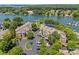 Waterfront condos with parking, landscaping, trees, and lake views for residents to enjoy at 7845 Village Harbor Dr, Cornelius, NC 28031