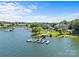 Beautiful waterfront condos with docks and lush green lawns, perfect for lakeside living at 7845 Village Harbor Dr, Cornelius, NC 28031