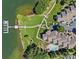 Aerial view showing a community, waterfront, pool, and landscaped grounds at 7845 Village Harbor Dr, Cornelius, NC 28031