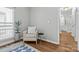 Comfortable bedroom nook with chair, plant, and modern design at 7845 Village Harbor Dr, Cornelius, NC 28031