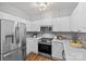 Well-equipped kitchen with stainless steel appliances, granite countertops, and ample cabinet space at 7845 Village Harbor Dr, Cornelius, NC 28031
