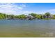 Picturesque view of the lakefront with boat docks and luxurious waterfront homes along the shoreline at 7845 Village Harbor Dr, Cornelius, NC 28031