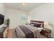 Staged bedroom with tasteful decor and neutral colors at 8953 Bradstreet Commons Way, Charlotte, NC 28215