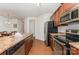 Well-lit kitchen features stainless steel appliances and granite countertops at 8953 Bradstreet Commons Way, Charlotte, NC 28215