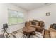 Comfortable living room features seating, a coffee table, and a view of the outdoors at 8953 Bradstreet Commons Way, Charlotte, NC 28215