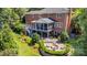 Beautiful backyard with a patio, firepit, and lush landscaping, perfect for outdoor entertaining at 905 Mangionne Dr, Matthews, NC 28105