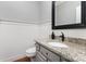Half bathroom with granite countertop and gray vanity at 905 Mangionne Dr, Matthews, NC 28105