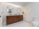 Modern bathroom with wood vanity and double sinks at 905 Mangionne Dr, Matthews, NC 28105
