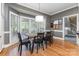 Dining room featuring a wood table, black chairs, and bay window at 905 Mangionne Dr, Matthews, NC 28105