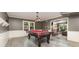 Spacious game room featuring a pool table with a red felt top and an adjacent living space at 905 Mangionne Dr, Matthews, NC 28105