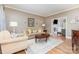 Relaxing living room with hardwood floors, natural light, and comfortable seating at 905 Mangionne Dr, Matthews, NC 28105