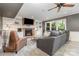 Inviting living room featuring a brick fireplace, built-in shelving, and ample seating at 905 Mangionne Dr, Matthews, NC 28105