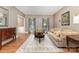 Cozy living room with hardwood floors, neutral decor, and comfortable seating at 905 Mangionne Dr, Matthews, NC 28105