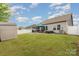 Spacious backyard with storage shed, fire pit, and patio with dining set and a grill at 9274 Dunwich Dr, Gastonia, NC 28056