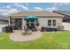 Backyard with patio, grill, hot tub, fire pit, and dining set at 9274 Dunwich Dr, Gastonia, NC 28056