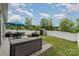 Spacious backyard with patio, dining set, grill, storage shed, and manicured lawn at 9274 Dunwich Dr, Gastonia, NC 28056