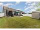 Backyard featuring patio, storage shed, grill and screened porch at 9274 Dunwich Dr, Gastonia, NC 28056