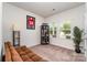 Cozy room with large windows letting in natural light and a comfy sofa, creating a peaceful retreat at 9274 Dunwich Dr, Gastonia, NC 28056