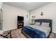 Comfortable bedroom with a mounted TV and pleasing decor, ideal for relaxation and entertainment at 9274 Dunwich Dr, Gastonia, NC 28056