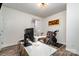 Comfortable home office with modern desk, executive chair, decor, and exercise equipment at 9274 Dunwich Dr, Gastonia, NC 28056
