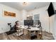 Office featuring modern desk, exercise equipment, decor shelving, and sleek lighting at 9274 Dunwich Dr, Gastonia, NC 28056