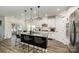 Modern kitchen with granite countertops, stainless steel appliances, an island and hardwood floors at 9274 Dunwich Dr, Gastonia, NC 28056