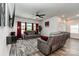 Spacious living room with plush seating, modern decor, and ample natural light from large windows at 9274 Dunwich Dr, Gastonia, NC 28056