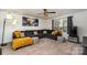 Spacious living room with comfortable seating, a stylish ceiling fan, and modern decor for enjoyable living at 9274 Dunwich Dr, Gastonia, NC 28056