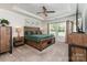 Spacious main bedroom with a tray ceiling, a large window and modern furnishings at 9274 Dunwich Dr, Gastonia, NC 28056