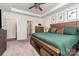 Spacious main bedroom with a tray ceiling, a large window and modern wood furnishings at 9274 Dunwich Dr, Gastonia, NC 28056