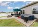 Backyard patio with outdoor dining, fire pit, and hot tub, ideal for relaxation at 9274 Dunwich Dr, Gastonia, NC 28056