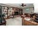 Cozy basement living area featuring a brick fireplace and built-in bookshelves at 928 Tally Ho Ct, Charlotte, NC 28212