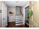 Traditional entryway features hardwood floors, staircase to upper level and entry to living spaces at 928 Tally Ho Ct, Charlotte, NC 28212
