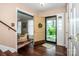 View from entryway showcasing hardwood floors and an open door to front yard with natural light at 928 Tally Ho Ct, Charlotte, NC 28212