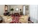 Comfortable living room featuring hardwood floors, an area rug, neutral paint and natural light at 928 Tally Ho Ct, Charlotte, NC 28212
