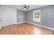 Bedroom showcasing hardwood floors, large closet, ceiling fan and natural light at 952 Salisbury St, Wadesboro, NC 28170