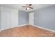 Bedroom showcasing hardwood floors, large closet, ceiling fan and natural light at 952 Salisbury St, Wadesboro, NC 28170