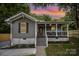 Charming bungalow-style home featuring a cozy front porch and freshly landscaped front yard at 952 Salisbury St, Wadesboro, NC 28170