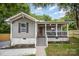 Charming bungalow-style home featuring a cozy front porch and freshly landscaped front yard at 952 Salisbury St, Wadesboro, NC 28170