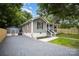 View of home exterior, driveway and storage shed at 952 Salisbury St, Wadesboro, NC 28170