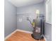 Functional utility room with water heater, laminate flooring and shelving at 952 Salisbury St, Wadesboro, NC 28170